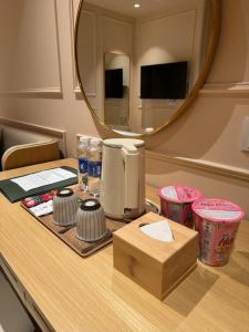 a table with a coffee maker and a mirror at Peace Home Boutique Hotel in Phan Thiet +50 photos