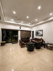 a large room with two ping pong tables in it at Kanchan Jayanti Villa in Khandāla