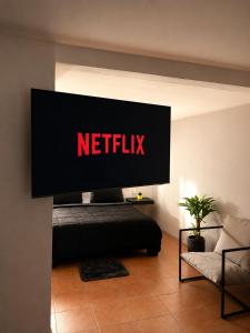 a television screen with a netflix sign on a wall at Oros Jalatlaco in Oaxaca City