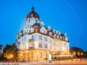 a large building with a dome on top of it at Rezydent Hotel Sopot - MGallery Collection in Sopot