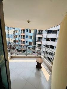 a balcony with a view of a building at Hotel Impulse Ocean View in Cox's Bazar