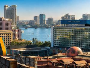 a view of a city with a river and buildings at Nile View Plaza Hotel in Cairo