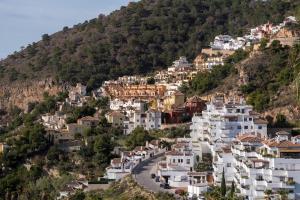 a village on the side of a mountain at Casa Cármenes del Mar in Almuñécar