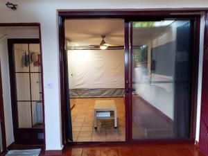 a sliding glass door with a bench in a room at Casa Cármenes del Mar in Almuñécar +35 photos