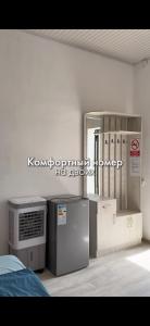 a room with a computer and other appliances in it at Зона отдыха Мирас in Kapchagay