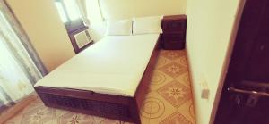 a small bed in a small room at lala salama in Zanzibar City
