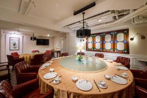 a conference room with a table and chairs at Charterhouse Causeway Bay in Hong Kong