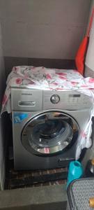 a washing machine with a bed on top of it at Guramishvili 5 in Kobuleti