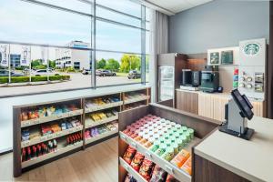 a cashier in a grocery store with a large window at Radisson Blu Hotel Amsterdam Airport, Schiphol in Schiphol