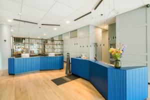 a large office with blue counters in a building at Radisson Blu Hotel Amsterdam Airport, Schiphol in Schiphol