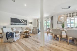 a living room with a couch and a table at Düne in Keitum