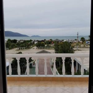 a view of the ocean from a balcony at Onde Rooms in Vlorë +2 photos