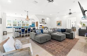 a living room with a couch and a table at Southern Living Cottage in Santa Rosa Beach
