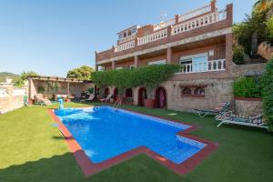 a house with a swimming pool in the yard at House close to the beach! Pool, ocean view! in Santa Susanna