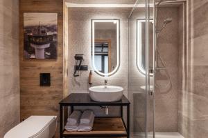 a bathroom with a sink and a shower at Apartamenty Solina 67 in Solina +63 photos