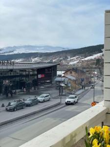 a view of a street with cars parked on the road at Central Apartment with Sauna & Balcony in Åre