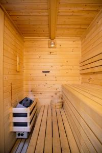 an inside of a wooden sauna at Villa Oasis Madrid in Batres +124 photos
