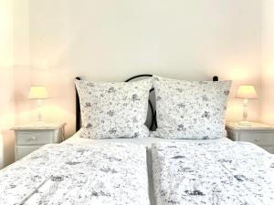 a bedroom with a bed with two night stands at Charming House in Carvoeiro + Pool in Carvoeiro