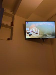 a flat screen tv hanging on a wall at Apartment in Shtip in Štip