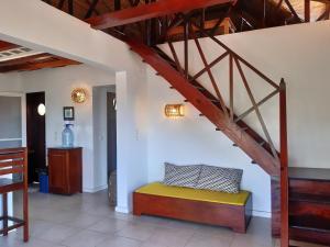 a room with a bench and a stair case at Exceptional house with sea view in Cap Skirring in Boukot Ouolof