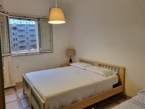a bedroom with a bed and a window at Beautiful Villa in Caccamo + Pool in Caccamo +16 photos