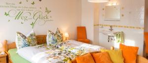 a room with a bed with pillows and a sink at Charming House in Pruggern, Mountain View in Pruggern