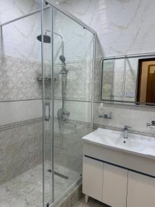 a bathroom with a shower and a sink at Al-Amin in Termiz +28 photos