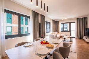 a dining room with a table and chairs at Boutique Suites in Lugano
