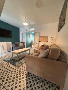a living room with a couch and a table at Maple, 3 Double Beds, Contractors Welcome in Abertillery