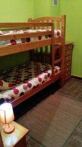 a bedroom with two bunk beds and a lamp at Charming Apartment in Castelserás - 60 sqm - Parking included in Castelserás +1 photo