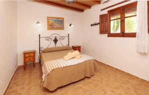 a bedroom with a bed and a window at Charming House in Montefrío with Private Pool in Montefrío +6 photos