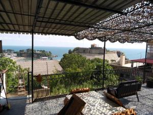 a patio with a view of the ocean from a house at Sea View Apartment Ulcinj 80 m² in Ulcinj