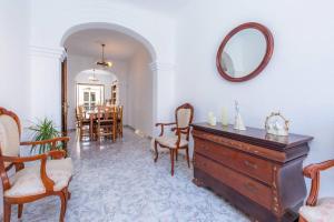 a living room with a dresser and a mirror at House by the sea in Can Picafort with terrace in Can Picafort