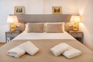 a bedroom with a large bed with white pillows at Charming Studio with Mountain View in Arinsal - 40m² in Arinsal