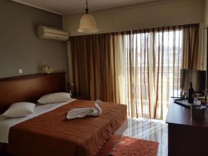 Postel nebo postele na pokoji v ubytování Apollo Hotel