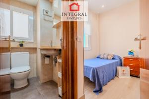 a small bathroom with a toilet and a sink at Casa Terral in Palamós +25 photos