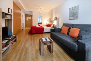 a living room with a couch and a bed at Modern studio in Arinsal of 40 m² with mountain view in Arinsal