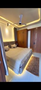 a bedroom with a large bed on a yacht at Cube Stay in Bhopal +4 photos