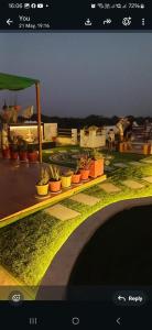 a screenshot of a picture of a garden with plants at Cube Stay in Bhopal