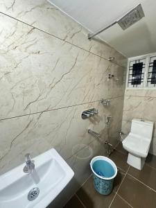 a bathroom with a sink and a toilet at DM Bliss in Chikmagalūr +55 photos