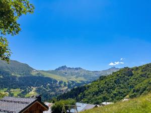 a view of a valley in the mountains at Chalet accueillant avec vue sur la montagne - 180 m² - Valmorel in Les Avanchers +23 photos