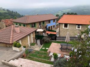 a house with a bench in front of it at Charming house in Biescas with shared pool in Biescas