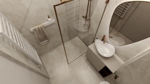 a white bathroom with a sink and a mirror at Apartamenty Kościuszki Winda Klimatyzacja in Iława