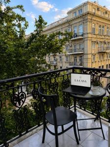 a laptop sitting on a table on a balcony at La Casa Boutique Nizami in Baku