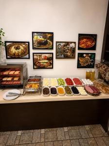 a buffet with many different types of food on a counter at La Casa Boutique Nizami in Baku