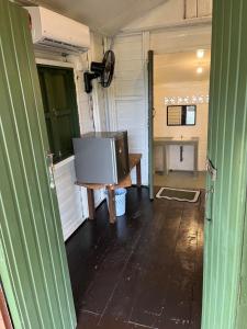 a television sitting on a table in a trailer at The Nest in Cherating +24 photos