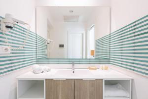 a bathroom with a sink and a mirror at Maison Il Corso in Sorrento +45 photos