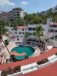 an aerial view of a resort with a swimming pool at CH Paradise Condesa in Acapulco