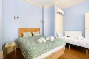 a bedroom with a bed with two pillows on it at Le chant de la garonne in Saint-Béat