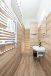 a bathroom with a sink and a glass shower at Penzion Anareta in Frýdek-Místek +107 photos